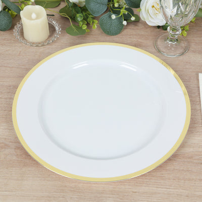 White plate with gold rim on wooden table setting