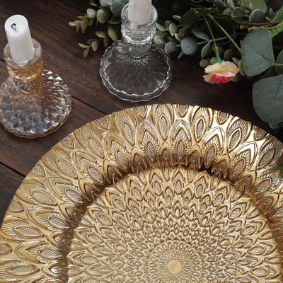 Gold decorative plate with intricate design on a wooden table.