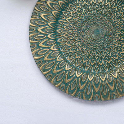 Decorative round plate with intricate teal and gold floral pattern design.