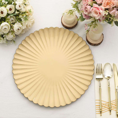Elegant scalloped beige plate on a table setting with floral arrangements.
