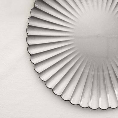 Silver scalloped serving plate with ribbed design