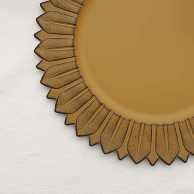 Sunflower-shaped decorative plate in warm yellow tones