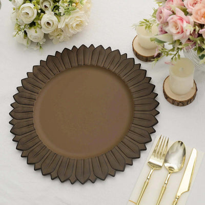 Decorative brown plate with a sunflower design, set on a dining table.