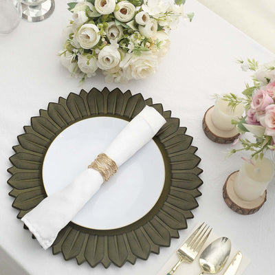 Elegant decorative plate with napkin and floral arrangement on a table setting.