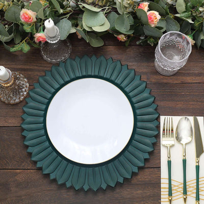 Teal leaf-shaped charger plate with a white center on a wooden table.