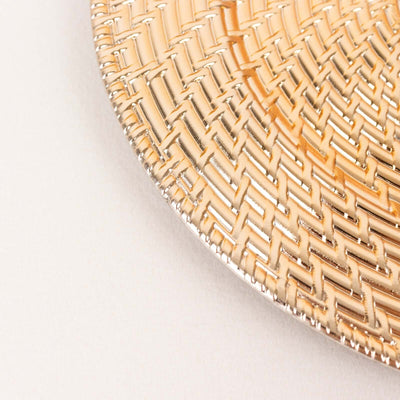 Gold woven decorative plate edge on light background.