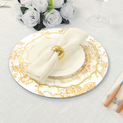 Elegant dining plate with floral design and napkin holder on table setting.
