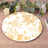 Floral decorative plate with yellow and white design on wooden table.