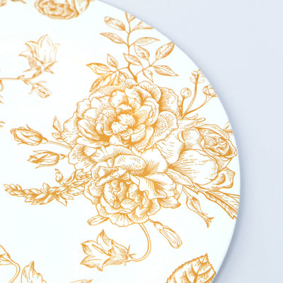 Floral-patterned plate with gold design on a white background