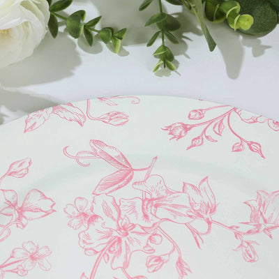 Floral-patterned plate with pink design on a white background.