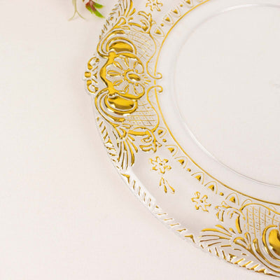 Elegant clear plate with gold detailing and ornate design.