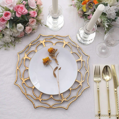 Elegant gold lace charger plate with a white plate and dried flower accent.