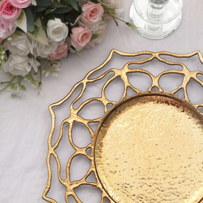 Gold decorative plate with intricate design on a light background.