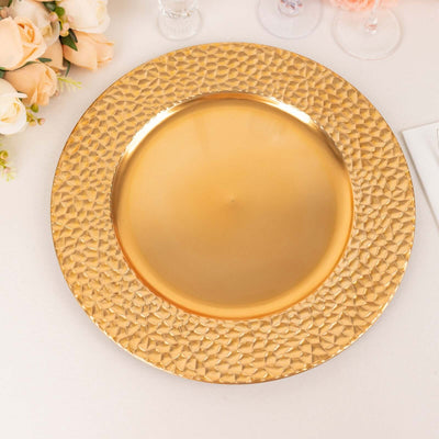 Gold textured charger plate on a plain background.