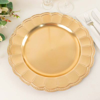 Gold decorative charger plate with scalloped edges.