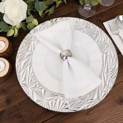 Elegant table setting with silver charger plate and white napkin.