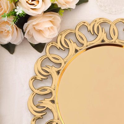 Gold decorative mirror with intricate border, surrounded by soft floral accents.