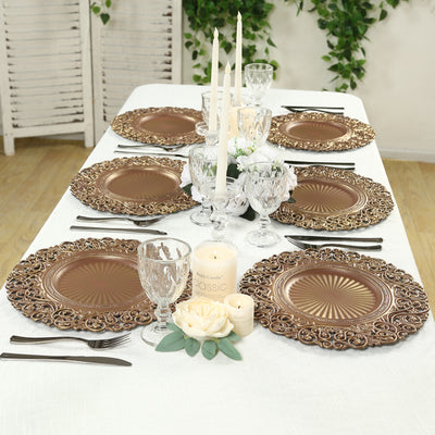 Elegant bronze decorative plates set on a beautifully arranged dining table.