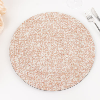 Round decorative plate with a textured geometric design in neutral tones.