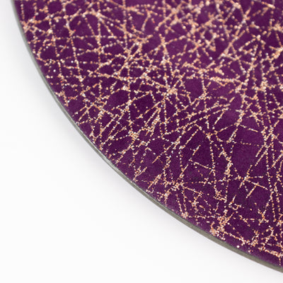Purple textured surface with glittery patterns.