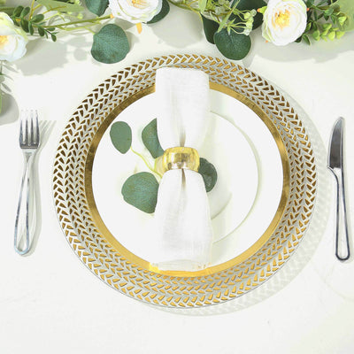 Elegant gold charger plate with white napkin, fork, and knife on a decorated table setting.