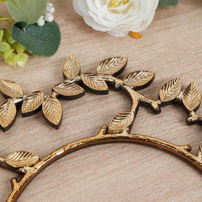 Gold leaf decorative wall art with intricate details and natural design.
