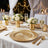 Elegant gold and white wedding table setting with roses and candles