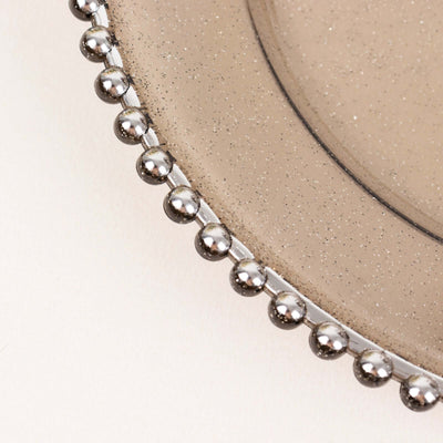 Decorative plate with metallic bead trim and speckled surface
