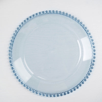 Blue glass plate with beaded edge on a white background