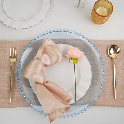Elegant table setting with floral accent and chic dinnerware.