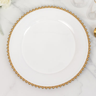 White dinner plate with gold beaded rim