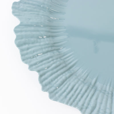 Light blue decorative plate with a textured, rippled edge