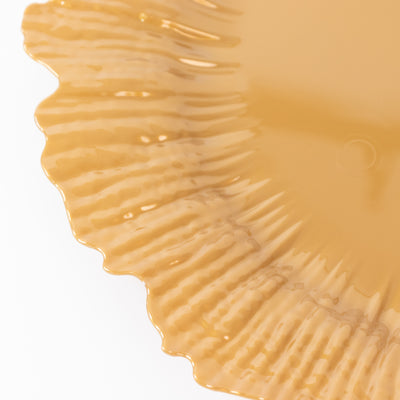 Amber fluted plate with a glossy finish
