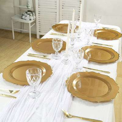 Elegant gold dinner plates set on a beautifully arranged table.