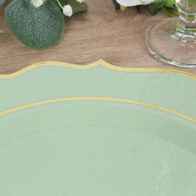 Green decorative plate with gold trim on a wooden table.