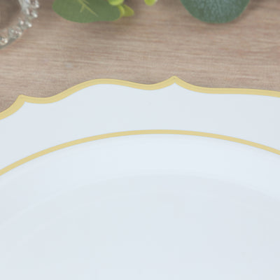 Elegant white plate with gold trim on a wooden surface.