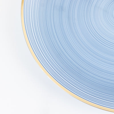 Blue decorative plate with textured design and gold rim