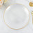 Elegant white plate with gold rim on a marble surface.