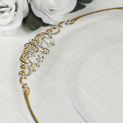 Elegant gold decorative plate with intricate design on a soft fabric backdrop.