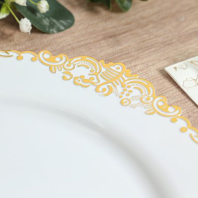 Elegant white plate with intricate gold detailing on the rim.
