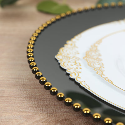 Elegant decorative plate with black and gold bead trim.