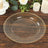 Clear decorative plate with gold beaded rim on a rustic wooden table.