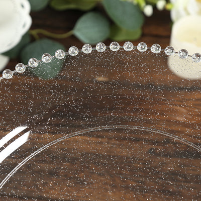 Clear glass plate with sparkling detail along the edge.