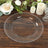 Elegant clear glass plate with beaded rim on rustic wooden table.