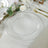 Clear charger plate with beaded rim on elegant table setting.