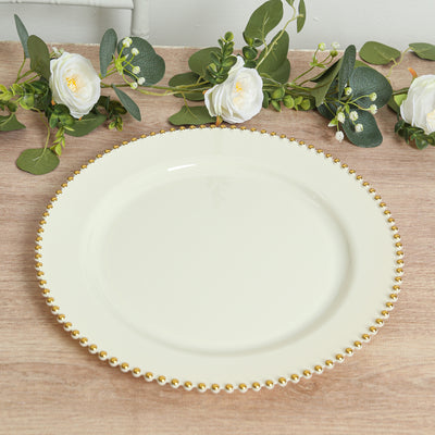 Elegant cream plate with gold beaded rim, styled with floral accents.