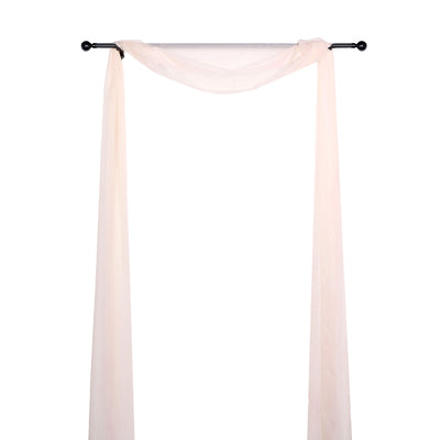 Sheer drapery fabric on a rod, creating an elegant backdrop for events.