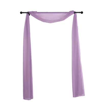 Purple sheer fabric draped on a black curtain rod