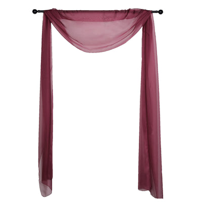Burgundy sheer fabric drapery on a black rod