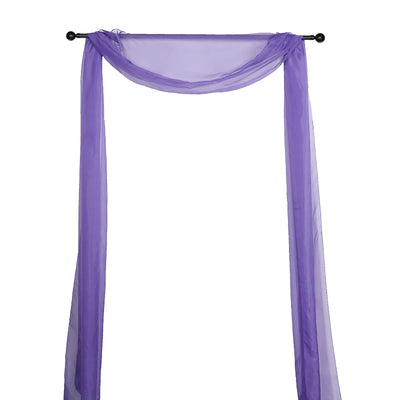 Purple sheer drapery fabric on a black curtain rod